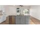 Kitchen island featuring a sink, gray cabinets, and stainless steel dishwasher at 16189 N 137Th Dr, Surprise, AZ 85374