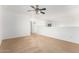 Comfortable living room featuring neutral carpet and a view to the hallway at 16189 N 137Th Dr, Surprise, AZ 85374