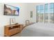Bedroom with a bed, bedside table, shuttered windows, and a television mounted on the wall at 16372 W Mulberry Dr, Goodyear, AZ 85395