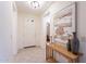 Inviting entryway features tiled floors, a console table, and natural light at 16372 W Mulberry Dr, Goodyear, AZ 85395