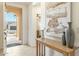 Bright entryway with tiled floors, a console table, and an arched doorway at 16372 W Mulberry Dr, Goodyear, AZ 85395