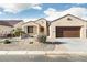 Charming single-story home with a stucco exterior, tile roof, and desert landscaping at 16372 W Mulberry Dr, Goodyear, AZ 85395