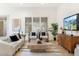 Stylish living room with modern furniture, large windows, and contemporary decor at 16372 W Mulberry Dr, Goodyear, AZ 85395