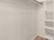 Walk-in closet featuring built-in shelving for optimal storage at 1718 S Longmore -- # 41, Mesa, AZ 85202