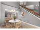 Open dining area with modern lighting and views of the kitchen and staircase at 1718 S Longmore -- # 41, Mesa, AZ 85202
