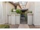 Charming courtyard entrance with secure gate and meticulously maintained stucco facade at 1718 S Longmore -- # 41, Mesa, AZ 85202