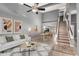 Open-concept living room flows into dining area, featuring neutral tones and tile flooring at 1718 S Longmore -- # 41, Mesa, AZ 85202