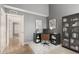 Bright home office with desk, bookcase, and views of the hallway at 1718 S Longmore -- # 41, Mesa, AZ 85202