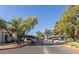 Designated parking area providing convenient parking for residents with mature landscaping at 1718 S Longmore -- # 41, Mesa, AZ 85202