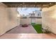 Enclosed patio featuring a fire pit, artificial turf, and string lights at 1718 S Longmore -- # 41, Mesa, AZ 85202