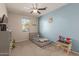 Brightly colored bedroom with a bed, toy storage, and a small table with chairs at 17583 W Paraiso Dr, Surprise, AZ 85387