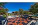 Outdoor chess board and benches, inviting residents to enjoy a strategic game in a serene setting at 17583 W Paraiso Dr, Surprise, AZ 85387
