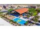 Aerial view of the community playground with splash pad, swings, picnic tables, and shade structures at 17583 W Paraiso Dr, Surprise, AZ 85387