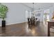 Bright dining room featuring hardwood floors, a farmhouse table, and ample space at 1812 W Kuralt Dr, Anthem, AZ 85086