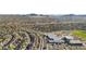 Wide aerial view of community with well-maintained homes, roads, and landscaping at 1812 W Kuralt Dr, Anthem, AZ 85086