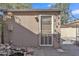 Charming backyard shed with a decorative screen door and plantings is perfect for storage or hobbies at 1822 S 39Th St # 17, Mesa, AZ 85206