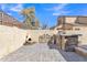 Charming backyard with custom stonework, built-in grill, and vintage decor for outdoor enjoyment at 1822 S 39Th St # 17, Mesa, AZ 85206