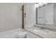 Bathroom with a granite vanity, updated fixtures, and shower-tub combo at 1822 S 39Th St # 17, Mesa, AZ 85206
