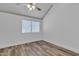 Comfortable bedroom featuring wood-look floors, a ceiling fan, and a window at 1822 S 39Th St # 17, Mesa, AZ 85206