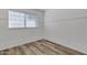 Bedroom with a large window and wood-look floors at 1822 S 39Th St # 17, Mesa, AZ 85206
