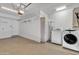 Garage with overhead lighting, laundry area, and work space at 1822 S 39Th St # 17, Mesa, AZ 85206