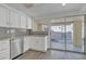 Updated kitchen with stainless steel dishwasher, modern countertops, and backyard patio access at 1822 S 39Th St # 17, Mesa, AZ 85206