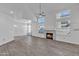 Bright, open living room with fireplace and ample natural light from the many windows at 1822 S 39Th St # 17, Mesa, AZ 85206