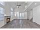 Bright living room features a fireplace, high ceilings, and wood-look tile flooring, creating a welcoming space at 1822 S 39Th St # 17, Mesa, AZ 85206