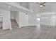 Spacious living room with wood-look tile flooring and staircase at 1822 S 39Th St # 17, Mesa, AZ 85206