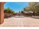 Inviting backyard with a fireplace, desert landscaping, and plenty of space at 19405 W Oregon Ave, Litchfield Park, AZ 85340