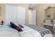 A bedroom offers a serene escape with a plush bed, a storage closet and a decorative mirror at 19405 W Oregon Ave, Litchfield Park, AZ 85340