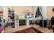 Bright room with hardwood floors, work tables and shelves at 19405 W Oregon Ave, Litchfield Park, AZ 85340