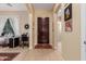 Inviting foyer featuring tile flooring and decorative front door at 19405 W Oregon Ave, Litchfield Park, AZ 85340