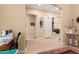 Hallway with tile flooring and decorative art pieces at 19405 W Oregon Ave, Litchfield Park, AZ 85340