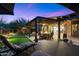 Expansive outdoor patio with lounge chairs, a covered dining area, and seamless access to the indoors at 2034 N Dome Rock --, Mesa, AZ 85207