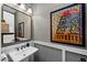 Stylish bathroom with a vessel sink, modern fixtures, and decorative artwork at 2034 N Dome Rock --, Mesa, AZ 85207