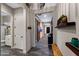 Stylish hallway showcases a decorative light fixture, barn doors, and an elegant color scheme at 2034 N Dome Rock --, Mesa, AZ 85207