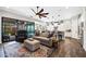 Open-concept living room and kitchen with a ceiling fan and sliding glass doors to the backyard at 2034 N Dome Rock --, Mesa, AZ 85207
