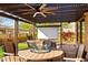 Outdoor covered patio featuring a ceiling fan, seating, and a projector screen for entertainment at 2034 N Dome Rock --, Mesa, AZ 85207