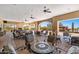 Spacious outdoor patio with comfortable seating, a fireplace, and views of the landscape at 2034 N Dome Rock --, Mesa, AZ 85207