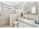 Bright bathroom featuring a granite countertop vanity and walk-in shower at 20827 N Stonegate Dr, Sun City West, AZ 85375