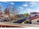 View of the apartment complex including parking spaces, buildings and blue sky at 2842 E Beck Ln # 2, Phoenix, AZ 85032