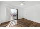 Bedroom featuring an outdoor patio with access from sliding glass doors and hardwood flooring at 2842 E Beck Ln # 2, Phoenix, AZ 85032