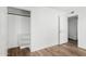 Bedroom closet with hardwood flooring, shelving and a large entrance door at 2842 E Beck Ln # 2, Phoenix, AZ 85032