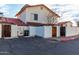Street view of a charming two-story home featuring reserved parking and private patio areas, red tile roofing at 2842 E Beck Ln # 2, Phoenix, AZ 85032