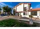 Charming two-story condo exterior featuring a red tile roof and balconies in a community setting at 2842 E Beck Ln # 2, Phoenix, AZ 85032