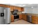 Well-equipped kitchen featuring stainless steel appliances, granite countertops, and tiled backsplash at 2842 E Beck Ln # 2, Phoenix, AZ 85032