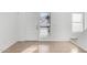Bright living room with neutral tile flooring, a white front door and large windows with mini blinds at 2842 E Beck Ln # 2, Phoenix, AZ 85032