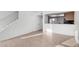 Open-concept living area showing the tile flooring with view of kitchen and staircase at 2842 E Beck Ln # 2, Phoenix, AZ 85032