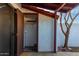 Open patio with access to a storage shed and view of a small tree, tiled floor, red ceiling at 2842 E Beck Ln # 2, Phoenix, AZ 85032